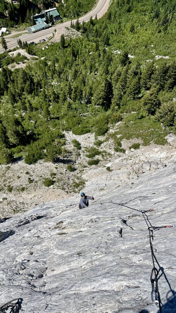 Wingsuit flight preparation on a desert ridgeline